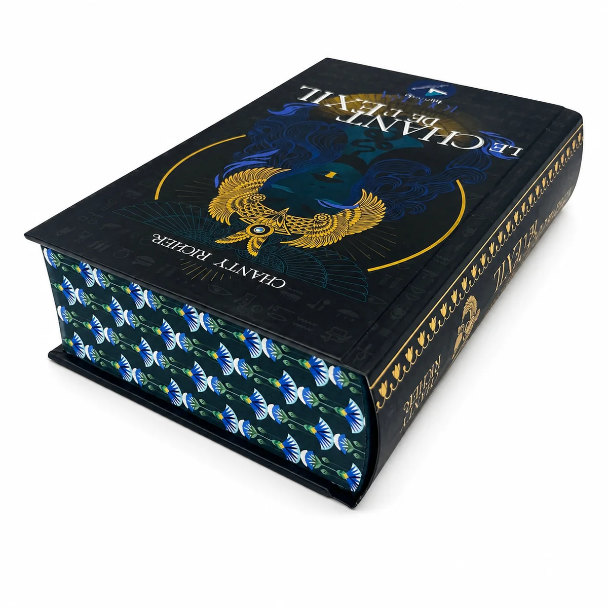 Ultra-thick hardcover fantasy novel with decorative edge printing, gold foil stamped cover, rounded spine, ribbon marker, and premium casebound binding.